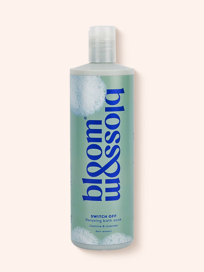 Relaxing bath soak in a turquoise bottle with blobs of bubbles across the 500ml bottle.