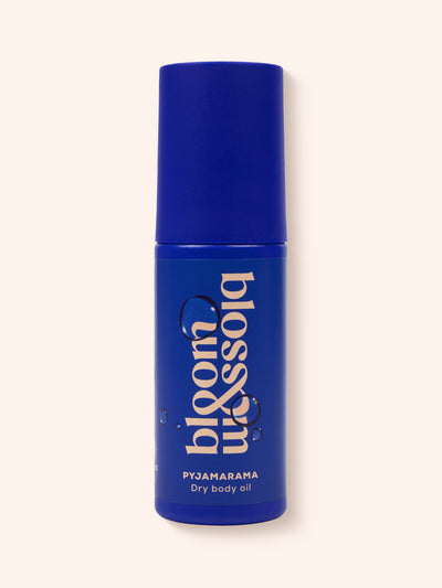 Pyjamarama Dry body oil in blue bottle, to deeply moisturise and nourish skin before bed.