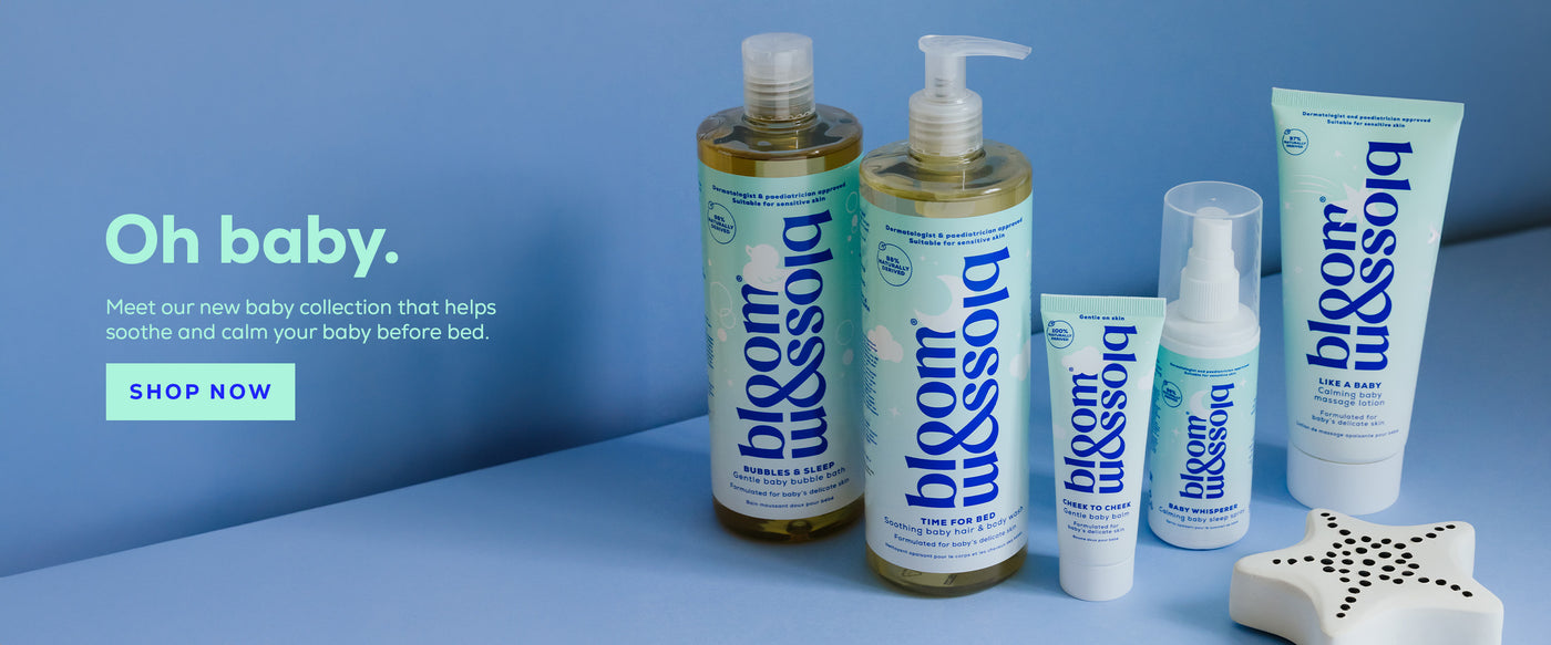 Oh baby, the new baby collection from Bloom and Blossom has landed. All 5 products are lined up on a blue background with a cute white toy in the foreground.