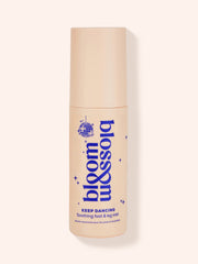 Bottle of Keep Dancing Soothing foot and leg mist. Bottle is of a blush colour with blue logo, text and disco ball.