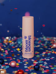 Bottle of Keep Dancing Soothing foot and leg mist, surrounded by falling confetti. A product to help soothe feet and legs after a night of dancing.