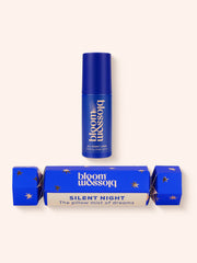 Dark blue Christmas cracker with shiny rose gold stars, Calming sleep spray encased inside.