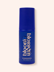 Pyjamarama Dry body oil in blue bottle, to deeply moisturise and nourish skin before bed.