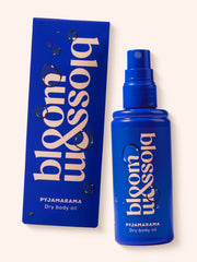 Pyjamarama Dry body oil in blue bottle and carton, to deeply moisturise and nourish skin before bed.