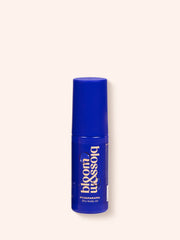 Pyjamarama Dry body oil in a mini-sized blue bottle, ideal for travel.